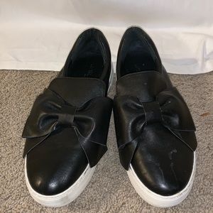Black sneakers with bow